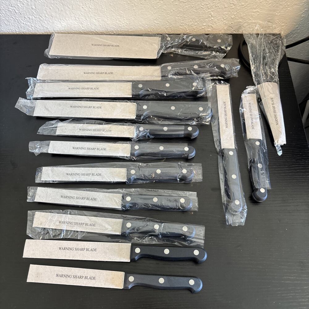 14 Piece serrated stainless steel blades and black handles with triple rivets